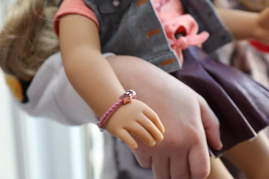 Closeup of American Girl Tenney's bracelet