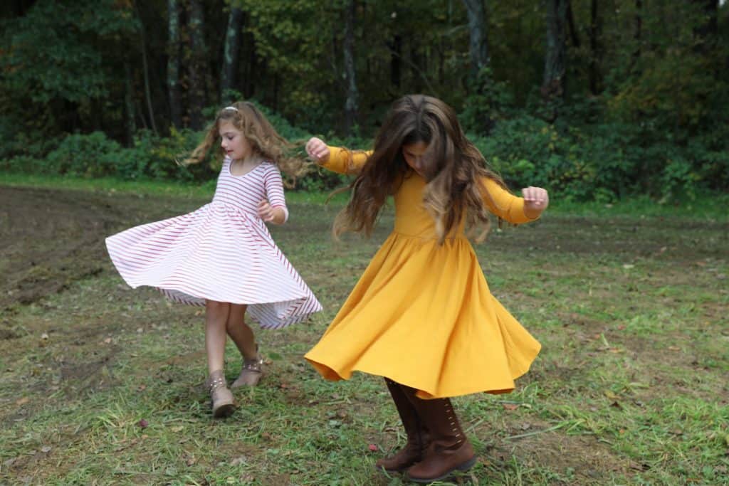 Girls twirling in Alice & Ames dresses