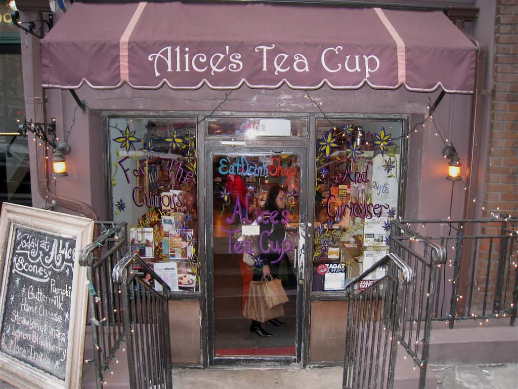 Alice's Tea Cup Restaurant exterior with pink awning and expansive windows 