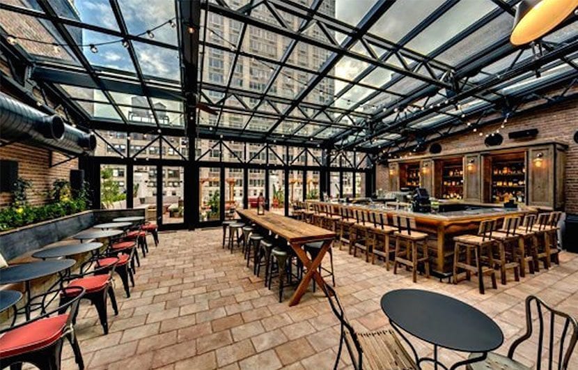 Refinery Rooftop in New York City with window ceiling and full bar