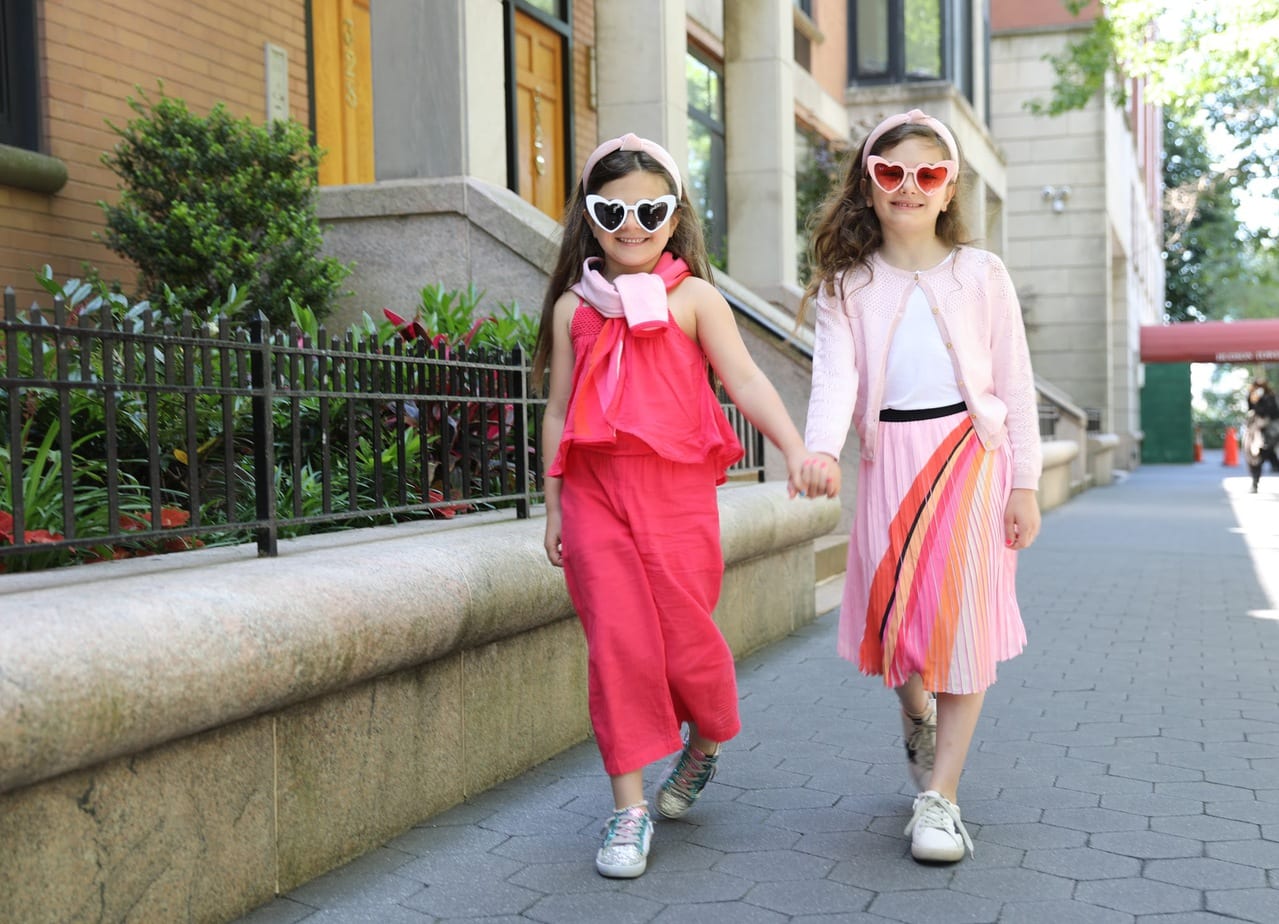 Two girls modeling Catimini Paris clothing
