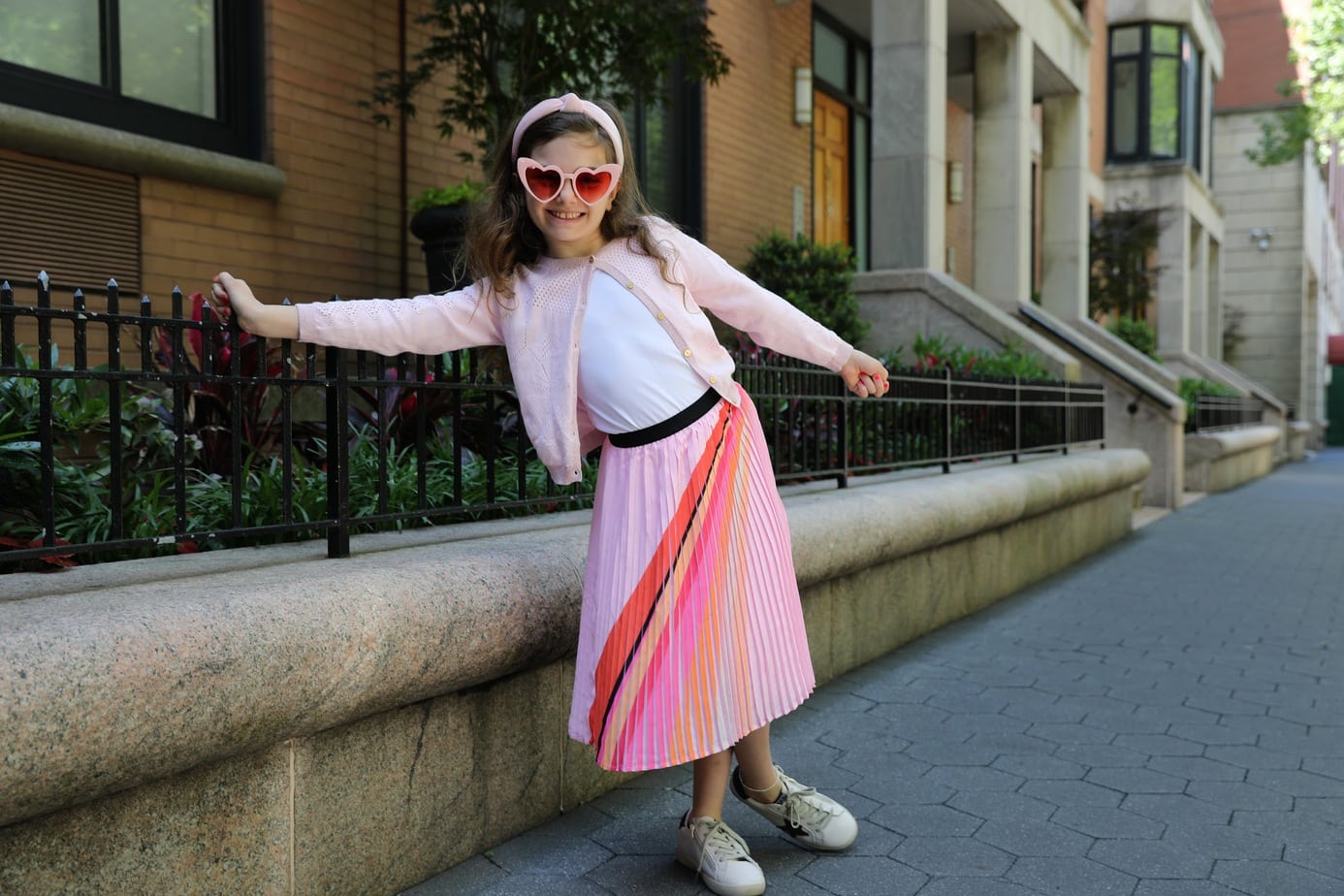 Girl in Catimini Paris skirt and cardigan