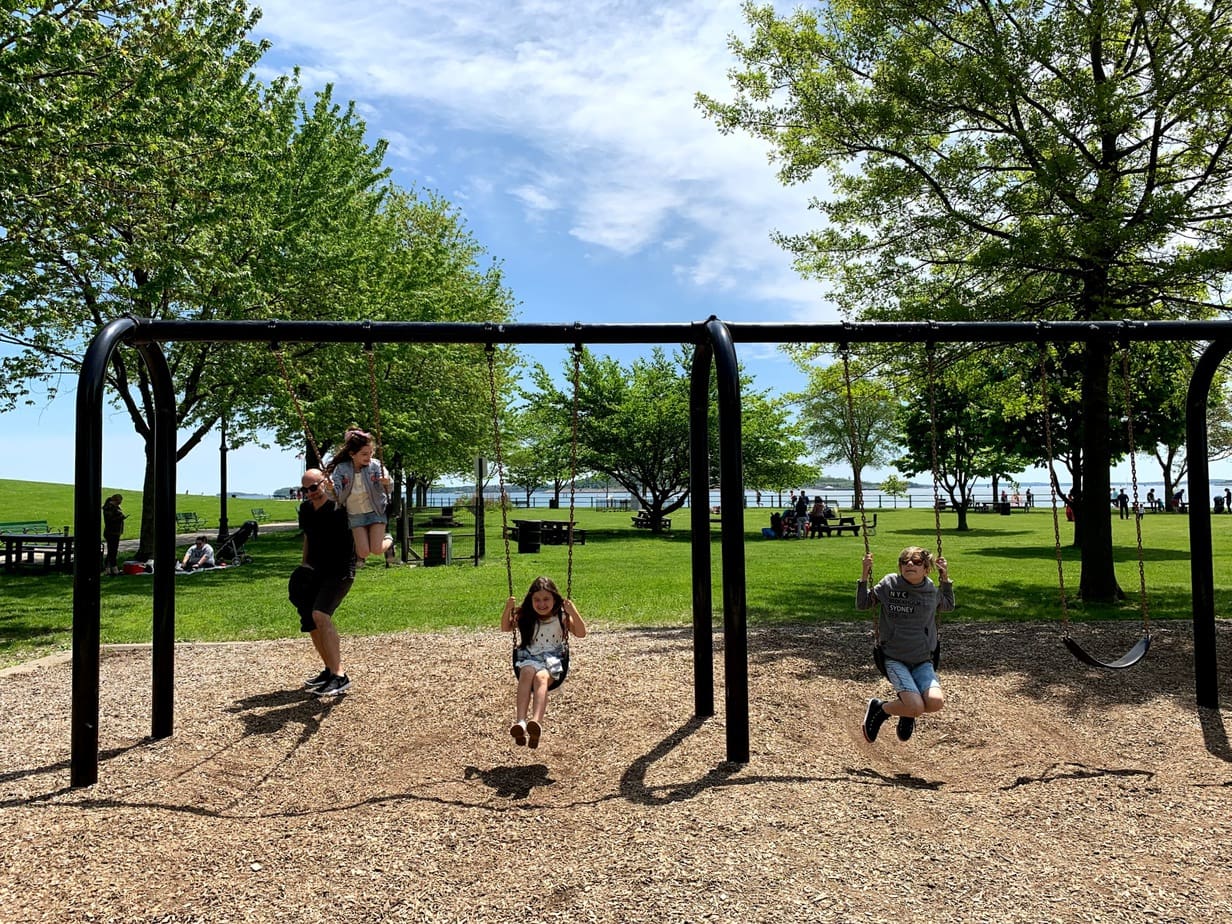 Kids playing in Castle Island playground during Boston Memorial Day weekend