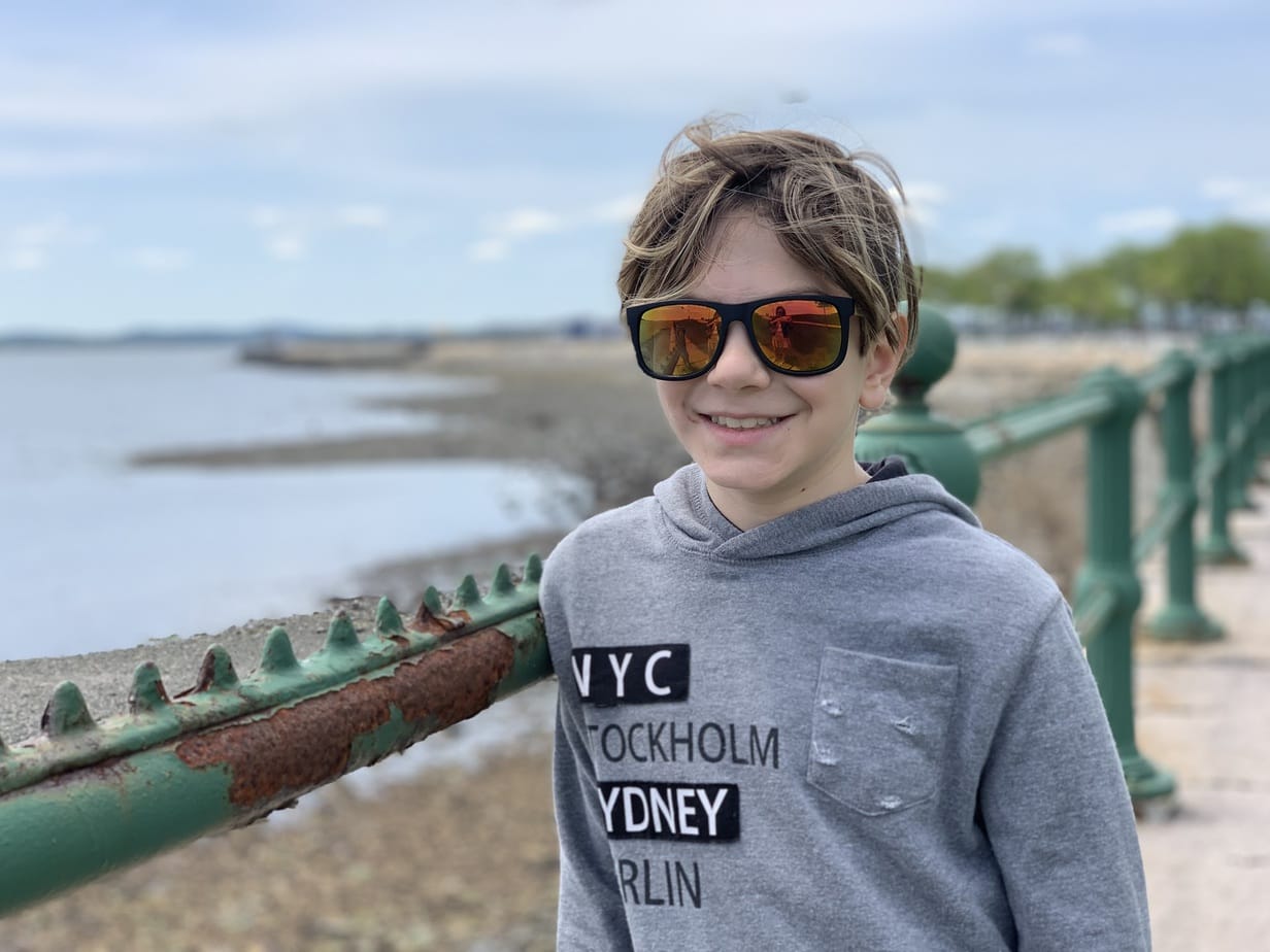 Child visiting Boston shore 