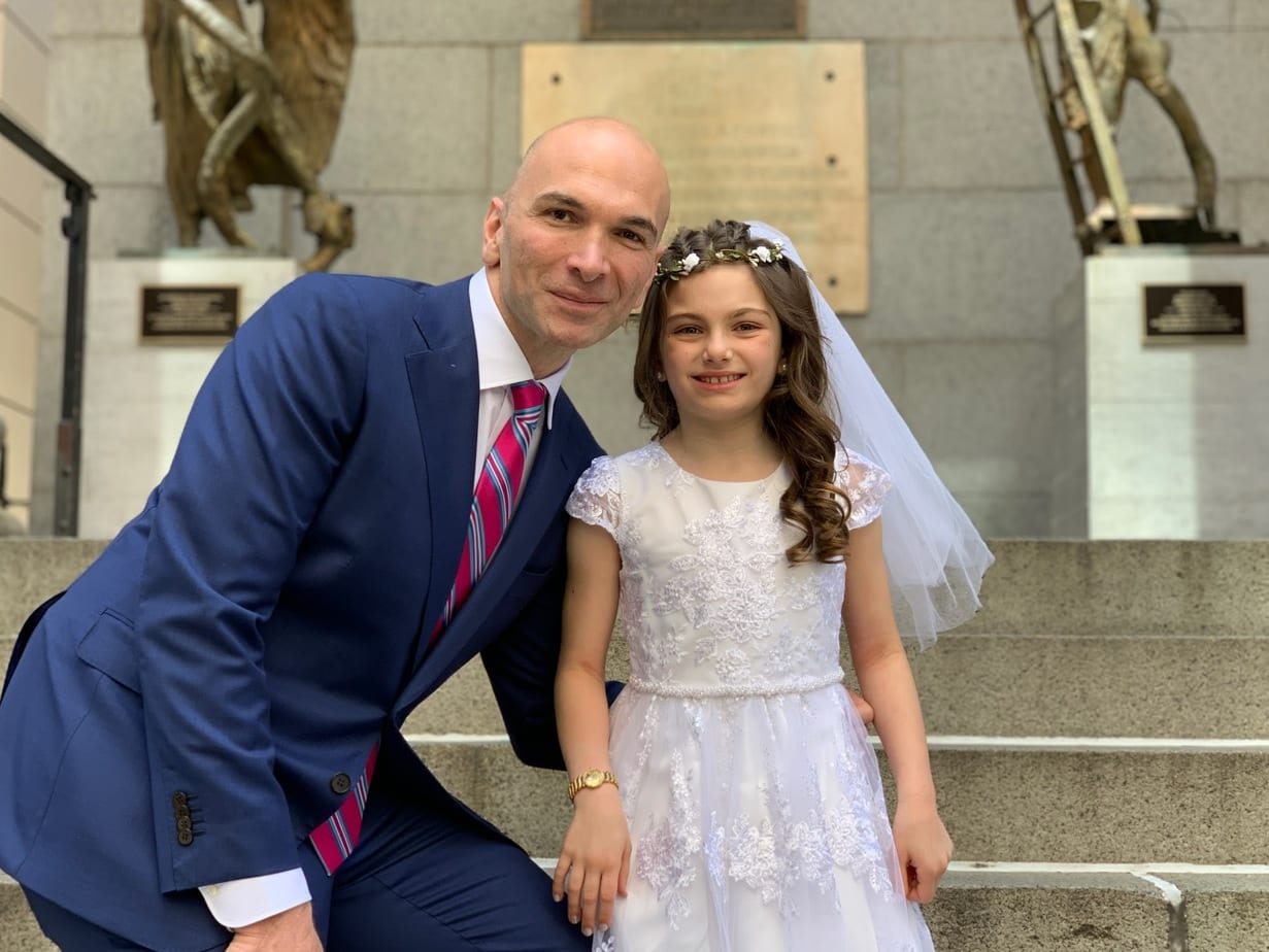 Father and daughter celebrating First Holy Communion