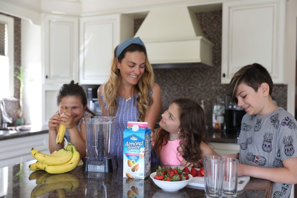 Family making smoothies with best plant-based milk