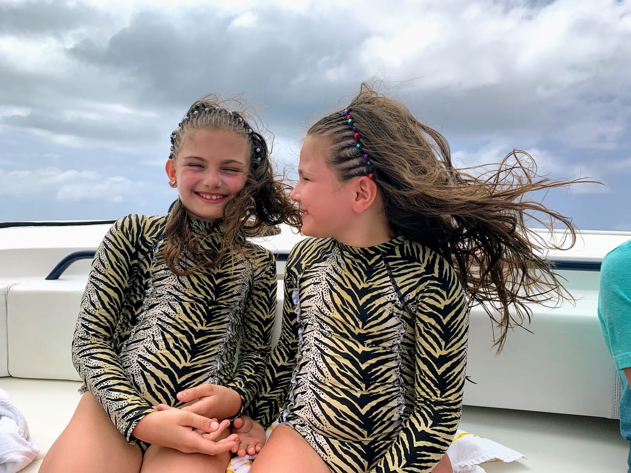Girls on the boat ride to Bamoral Island inThe Bahamas