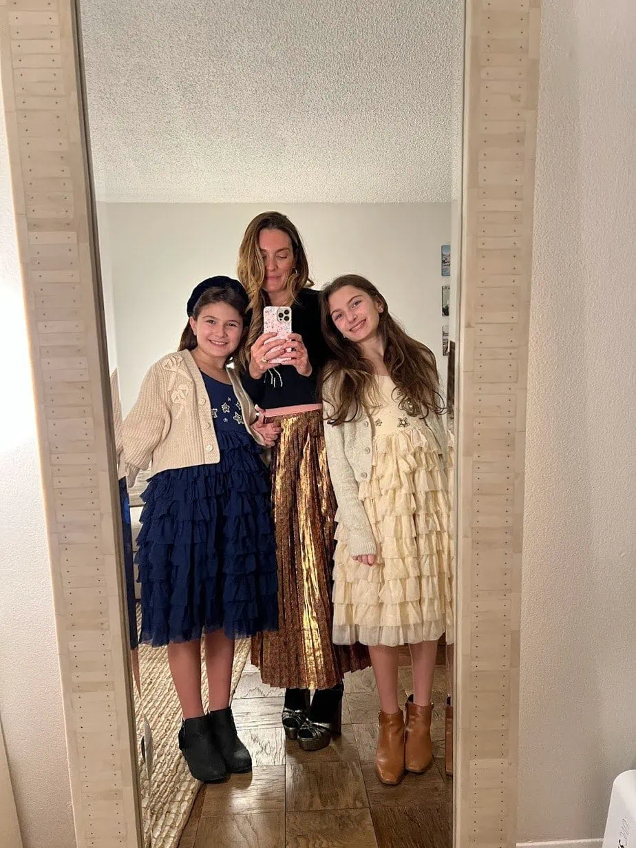 Mirror selfie with family in holiday outfits