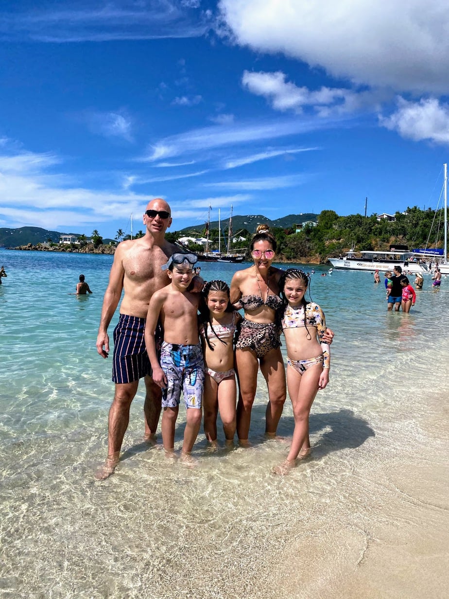 Family swimming in the beautiful beaches of St. Thomas