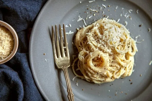 NYC best fall restaurants Via Carota's famous dish Cacio e Pepe served with a sprinkle of cheese 