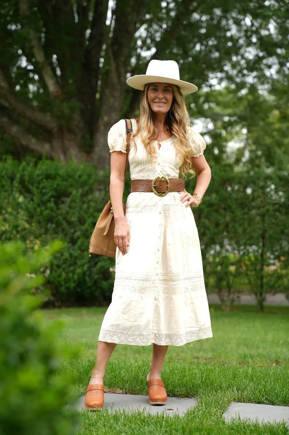 Brianne sporting cute look of yellow dress, country hat, and brown clogs 