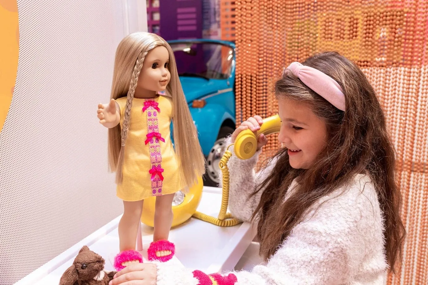 Daughter playing with dolls a the American Girl Doll store in NYC