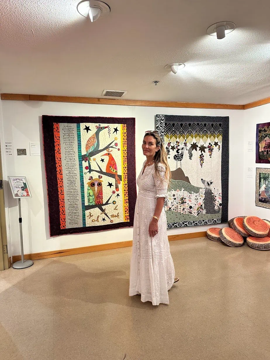 Brianne wearing white dress while exploring the Liberty Station art gallery