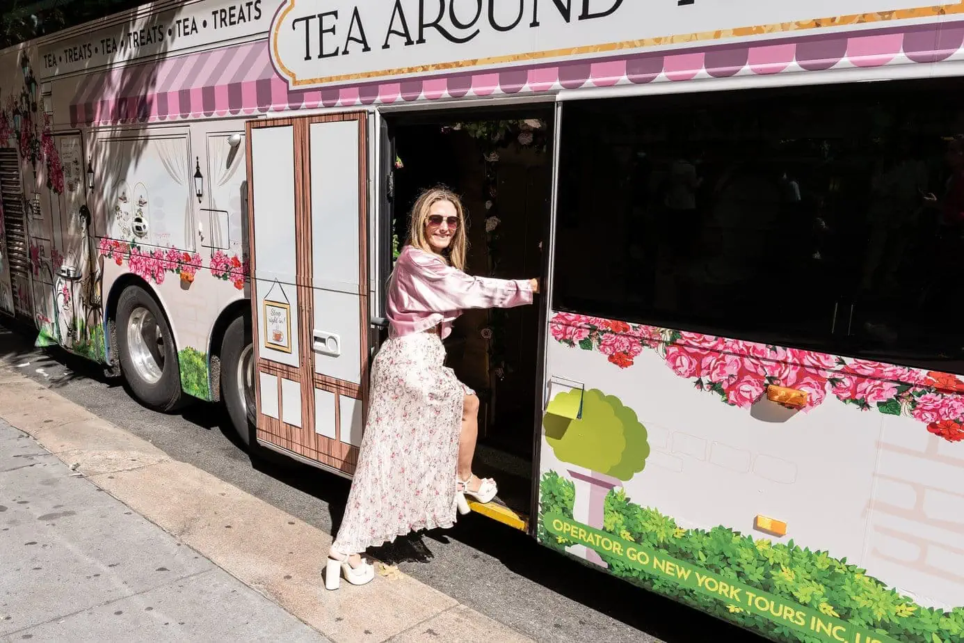 Brianne in Loveshackfancy pink outfit while stepping on to the Tea Around Town Tourist Bus in NYC