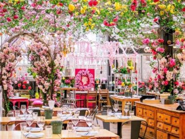 Serra rooftop restaurant in New York City with pink floral interior