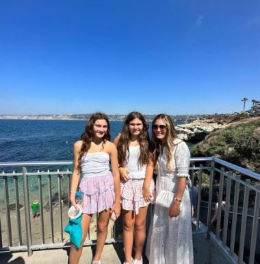 Mother and daughters enjoying beach view in San Diego